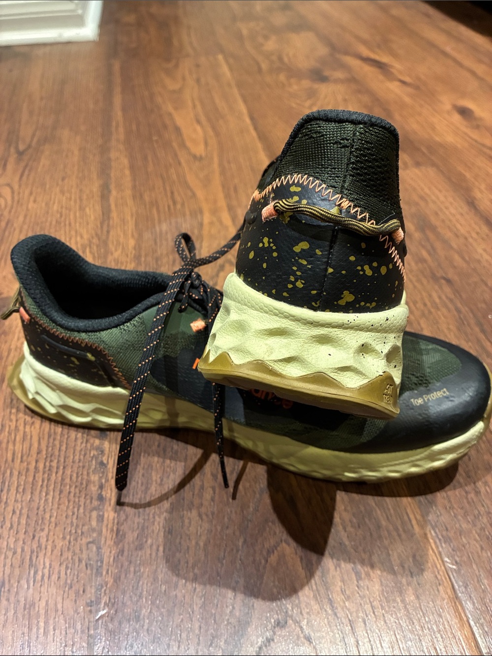 New Balance Olive Green and Black Trail Sneakers with Orange Accents - Picture 9 of 9